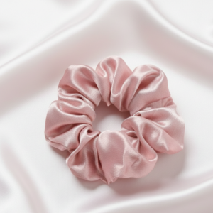 Single large 10cm baby pink satin silk scrunchie on white silk background