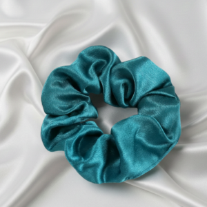 Single large 10cm teal emerald satin silk scrunchie on white silk background