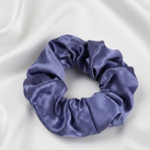 Single large 10cm dark purple satin silk scrunchie on white silk background