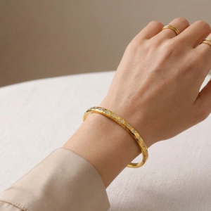 Celestial 18k gold PVD coated 304 stainless steel bangle with zircon stones and diamond-cut texture itBlinx